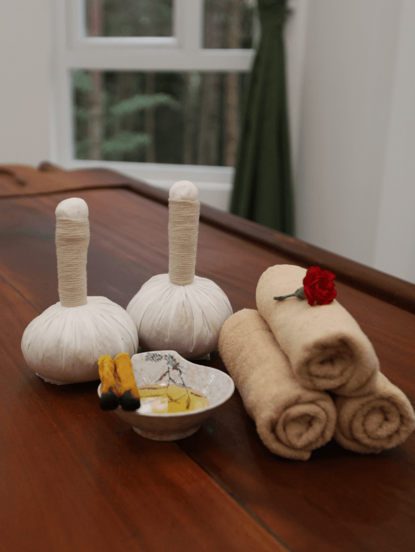 Ayurvedic herbs and oils on table