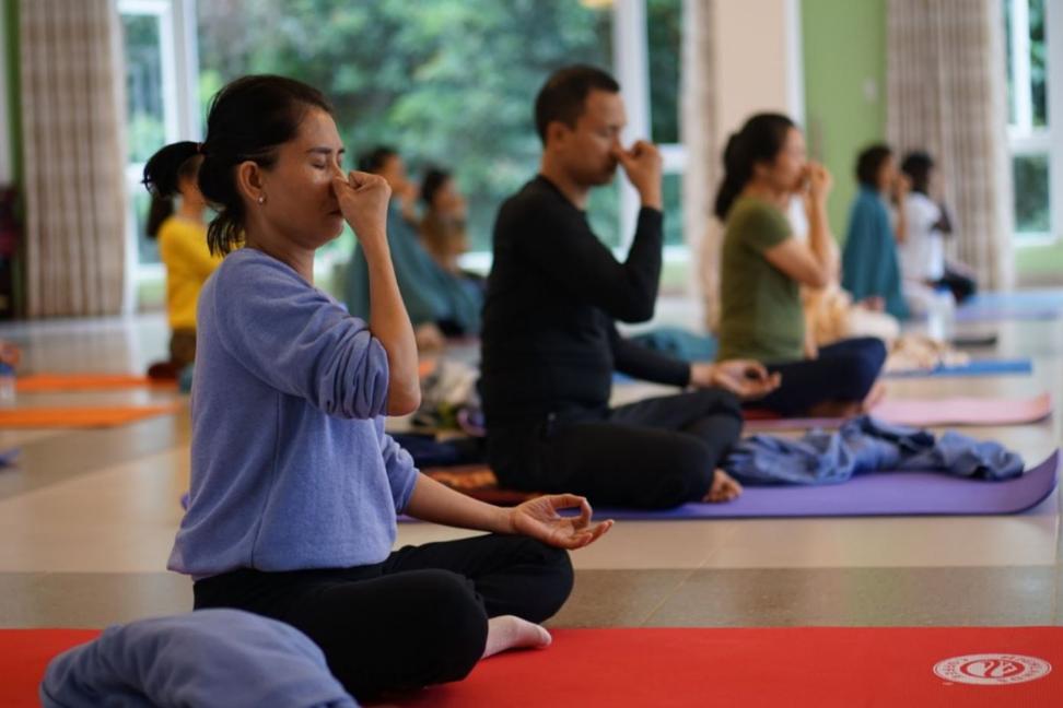 group pranayama in a row